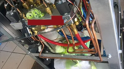 Polymerised R1234yf in the lines and filters of an A/C service unit